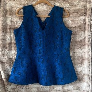 Lace details make this flared top stand out